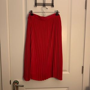 Red pleated midi skirt